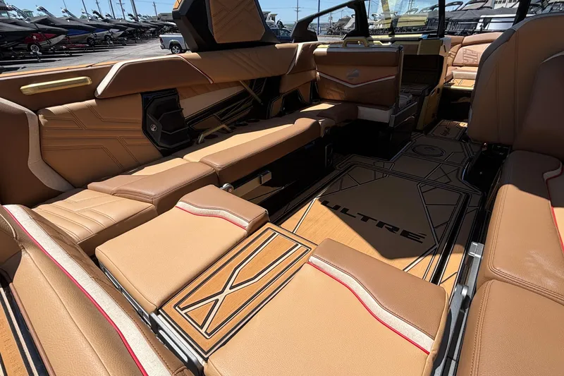 Slide: The Image of Luxurious interior of 2026 Tigé Ultré 25ZX boat with tan leather seating. - 20