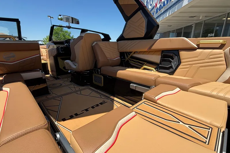 Slide: The Image of 2026 Tigé Ultré 25ZX boat interior with luxurious tan seating and modern design. - 21