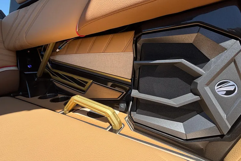Slide: The Image of 2026 Tigé Ultré 25ZX interior with tan upholstery and sleek speaker design. - 22