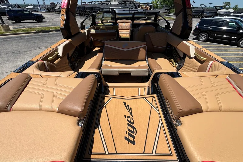 Slide: The Image of 2026 Tigé Ultré 25ZX boat interior with luxurious tan seating and stylish design. - 28