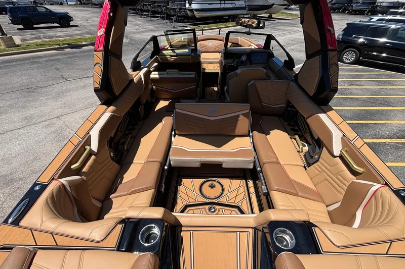 Slide: The Image of 2026 Tigé Ultré 25ZX boat interior with luxurious tan seating and modern design. - 29