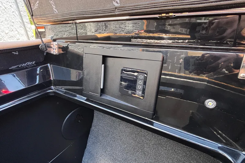 Slide: The Image of Control panel of 2026 Tigé Ultré 25ZX boat, featuring sleek black design. - 34