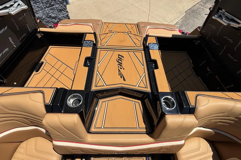 Slide: The Image of 2026 Tigé Ultré 25ZX boat interior with tan upholstery and sleek design. - 35