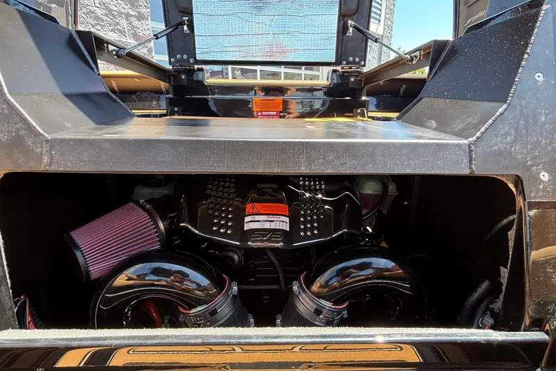 Slide: The Image of Engine compartment of 2026 Tigé Ultré 25ZX boat, showcasing powerful components and design. - 36