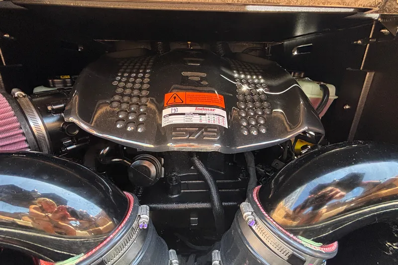 Slide: The Image of Engine compartment of 2026 Tigé Ultré 25ZX boat, featuring a powerful Indmar engine. - 37