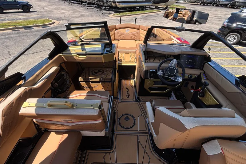 Slide: The Image of 2026 Tigé Ultré 25ZX boat interior with luxurious seating and modern dashboard design. - 38