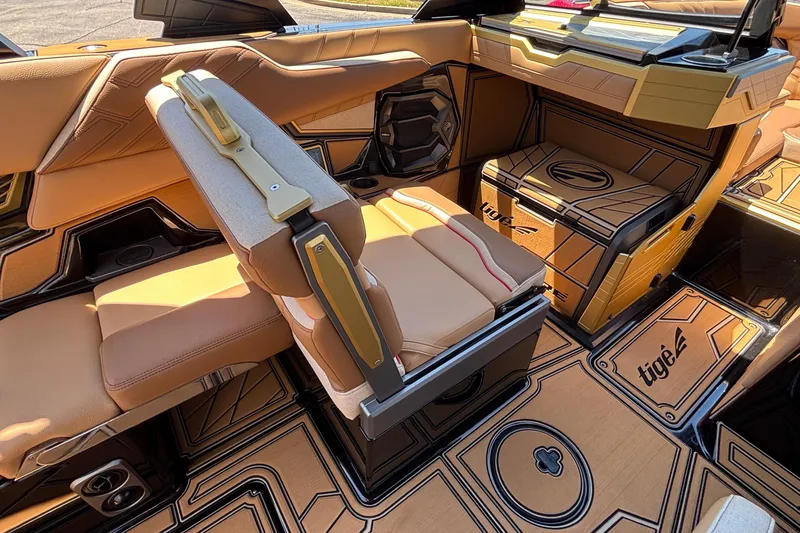 Slide: The Image of 2026 Tigé Ultré 25ZX boat interior with luxurious tan seating and modern design. - 40