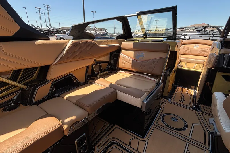 Slide: The Image of Luxurious interior of 2026 Tigé Ultré 25ZX boat with tan leather seating. - 43