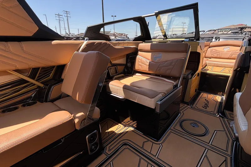 Slide: The Image of Luxurious interior of 2026 Tigé Ultré 25ZX boat with tan leather seating and stylish design. - 44