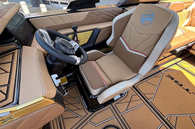 Slide: The Image of Luxurious interior of 2026 Tigé Ultré 25ZX boat with modern steering and seating. - 46