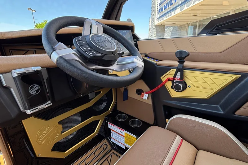 Slide: The Image of Interior of 2026 Tigé Ultré 25ZX boat, featuring modern steering wheel and controls. - 48