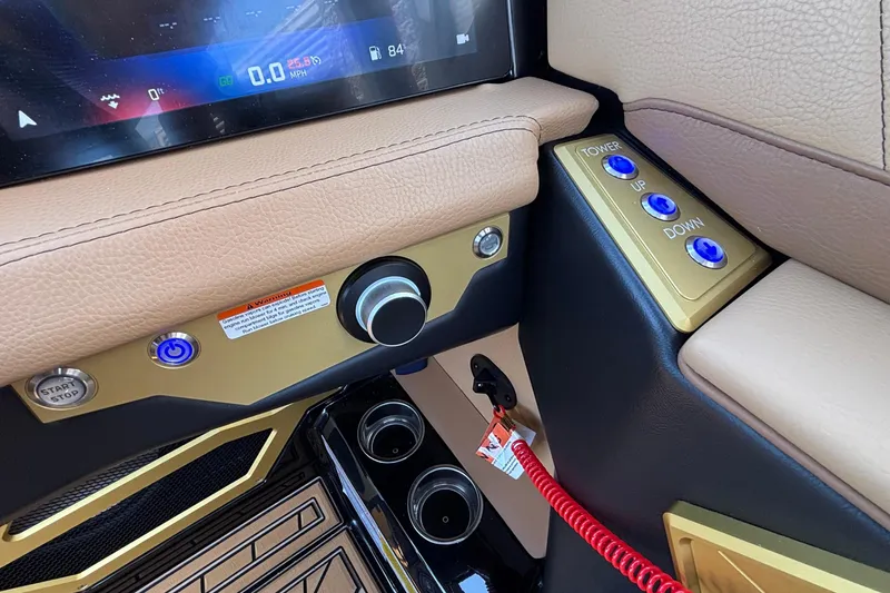 Slide: The Image of 2026 Tigé Ultré 25ZX dashboard with control buttons and digital display. - 50