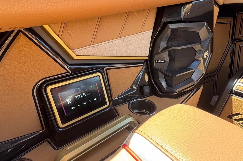 Slide: The Image of Interior of 2026 Tigé Ultré 25ZX boat featuring audio system and speaker. - 52