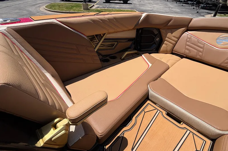 Slide: The Image of Luxurious interior of 2026 Tigé Ultré 25ZX boat with tan leather seating. - 59