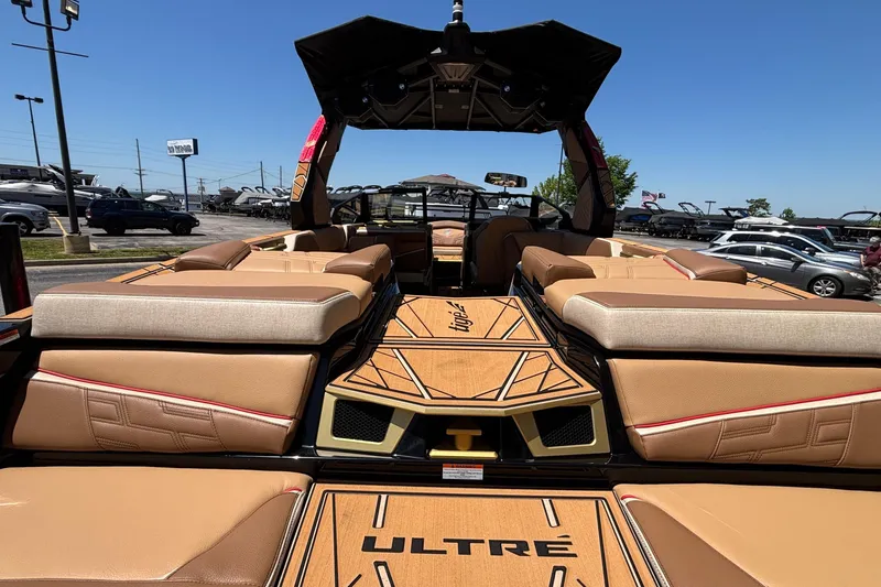 Slide: The Image of 2026 Tigé Ultré 25ZX boat interior with tan seating and stylish design. - 6