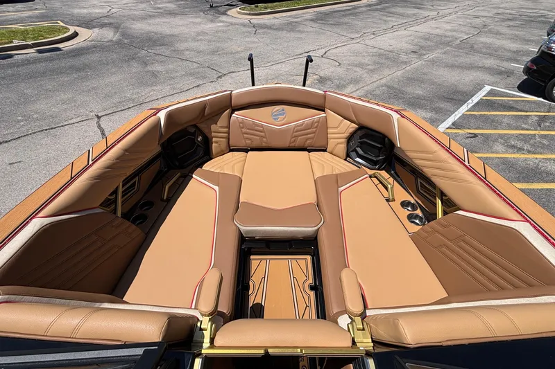 Slide: The Image of Luxurious interior of 2026 Tigé Ultré 25ZX boat with tan leather seating. - 62