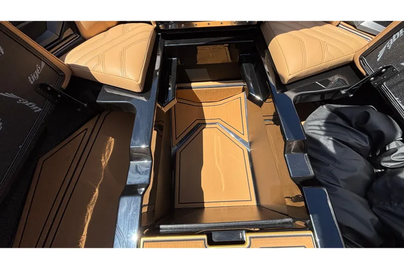 Slide: The Image of Interior view of 2026 Tigé Ultré 25ZX boat with tan seating and sleek design. - 66