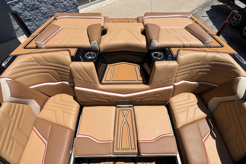 Slide: The Image of 2026 Tigé Ultré 25ZX boat interior with luxurious tan seating and modern design. - 68