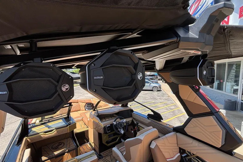 Slide: The Image of 2026 Tigé Ultré 25ZX boat interior with premium Audison speakers and luxurious seating. - 69