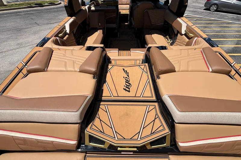 Slide: The Image of 2026 Tigé Ultré 25ZX boat interior with luxurious tan seating and stylish design. - 7