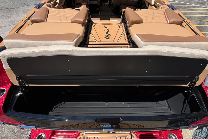 Slide: The Image of 2026 Tigé Ultré 25ZX boat interior with luxurious seating and storage compartment. - 8