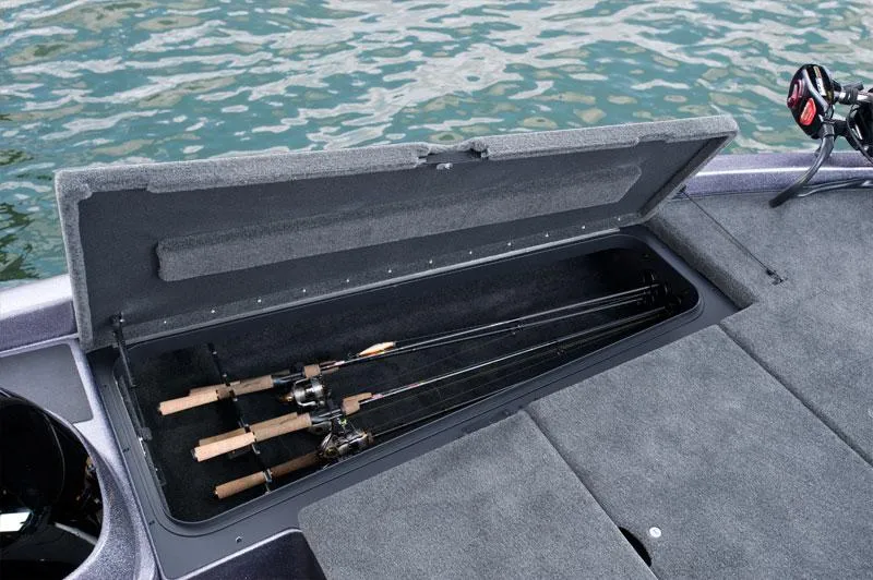 Slide: The Image of Manufacturer Provided Image: 2014 Skeeter TZX 195 boat with open storage compartment holding fishing rods. - 5