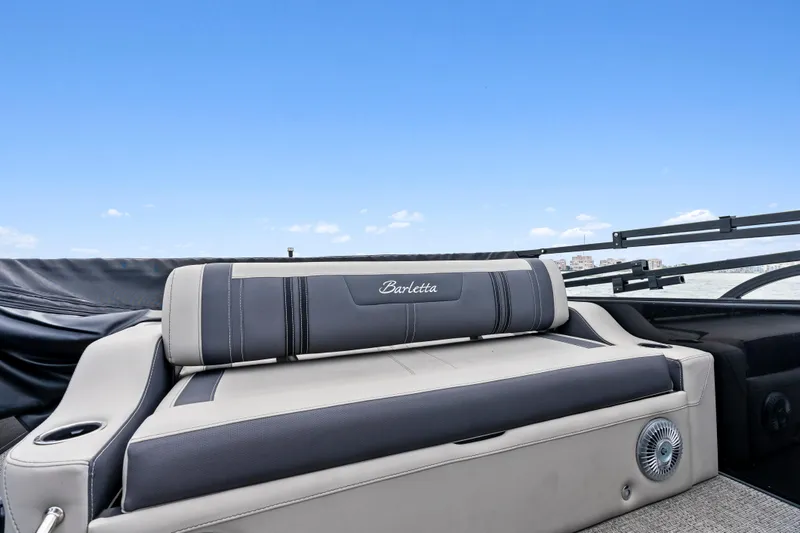 Slide: The Image of 2025 Barletta Corsa 23UC boat interior with luxurious seating and sleek design. - 14