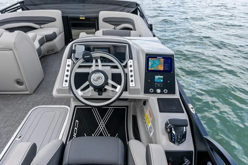 Slide: The Image of Cockpit of 2025 Barletta Corsa 23UC boat with modern steering and navigation system. - 8