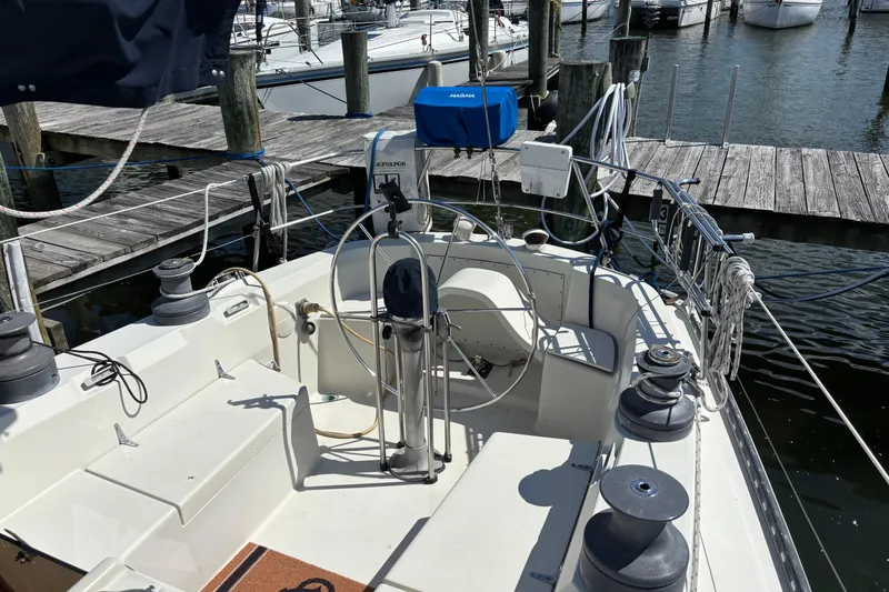 Slide: The Image of Cockpit of a 1980 C&C 40-2 sailboat docked at a marina. - 10