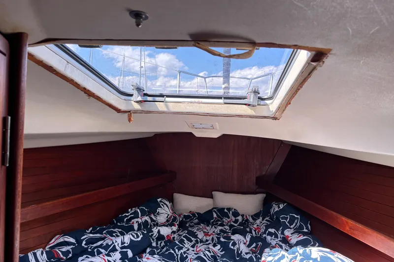 Slide: The Image of Cozy cabin interior of 1980 C&C 40-2 sailboat with skylight and bedding. - 21