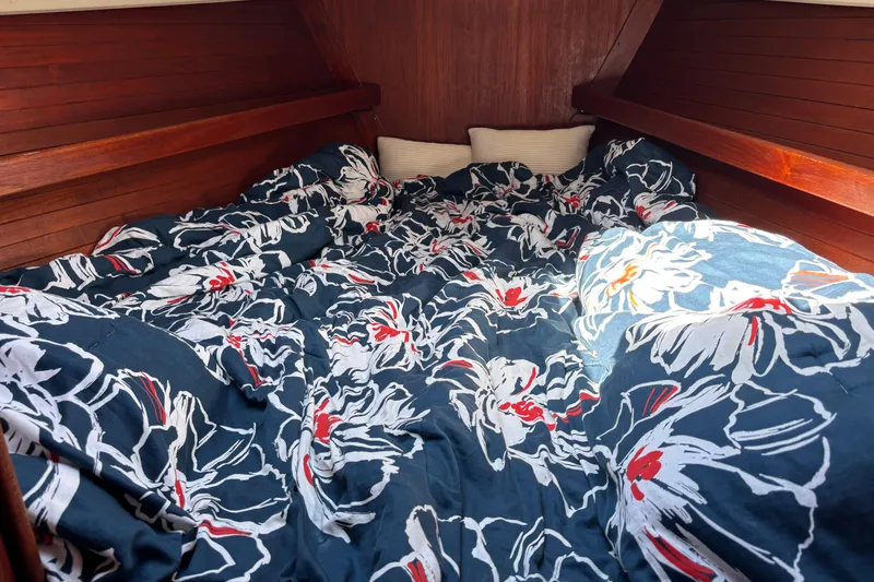 Slide: The Image of Cozy cabin interior of 1980 C&C 40-2 sailboat with floral bedding. - 22