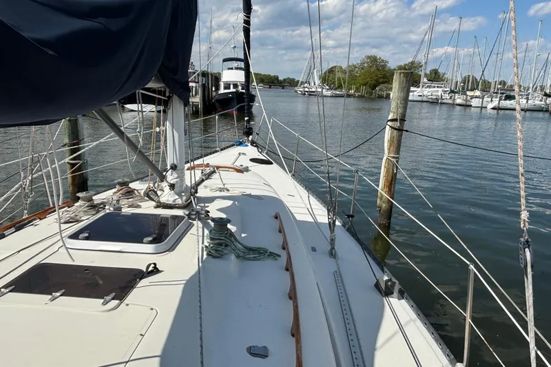 Slide: The Image of 1980 C&C 40-2 sailboat docked in a marina with clear skies. - 3