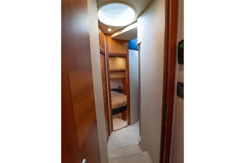 Slide: The Image of Interior hallway of 2008 Azimut Fly 50 yacht, featuring wood paneling and cozy cabin entrance. - 10