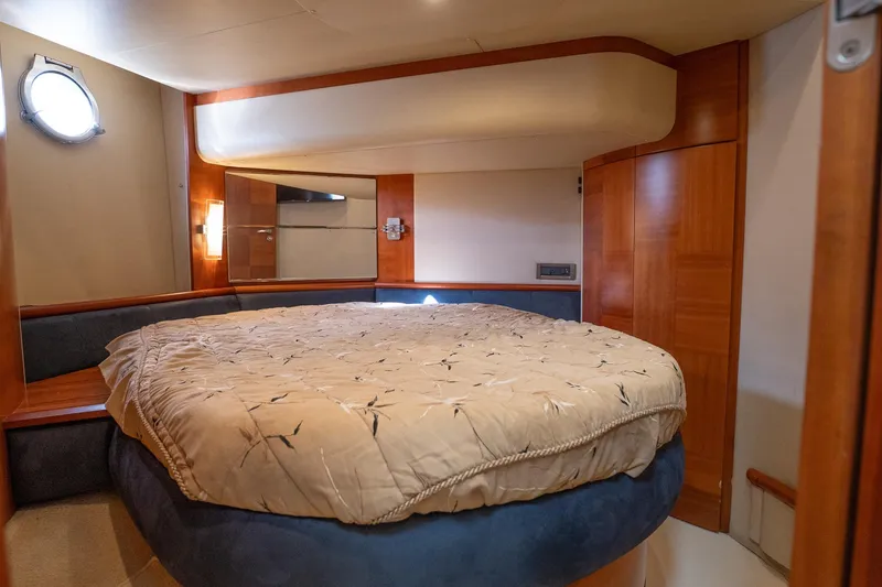 Slide: The Image of Luxurious bedroom interior of 2008 Azimut Fly 50 yacht with cozy bedding and wooden accents. - 11