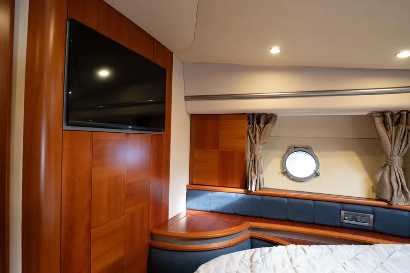 Slide: The Image of Luxurious interior of 2008 Azimut Fly 50 yacht with wood paneling and porthole window. - 15