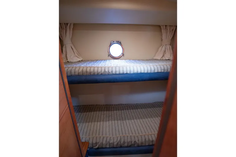 Slide: The Image of Bunk beds in 2008 Azimut Fly 50 yacht cabin with porthole window. - 17
