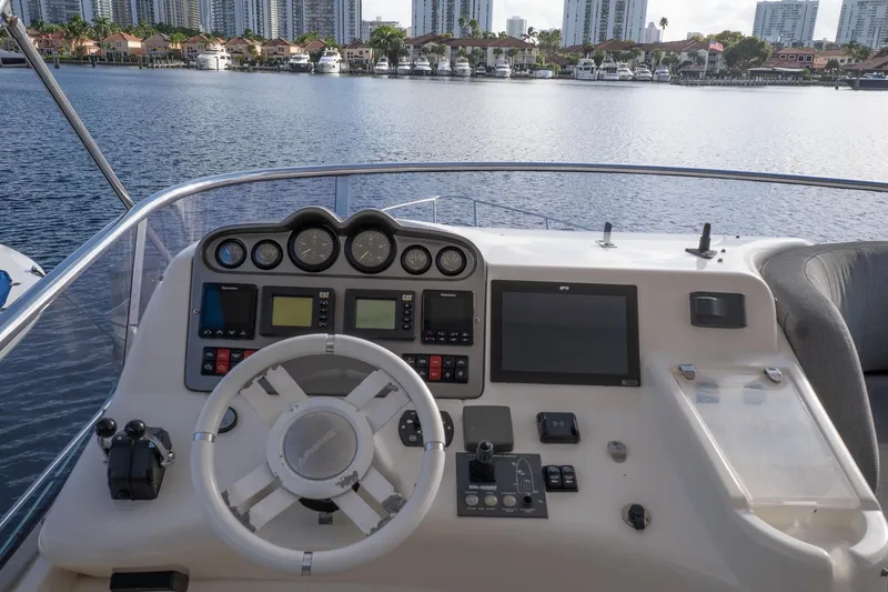 Slide: The Image of Cockpit of 2008 Azimut Fly 50 yacht with steering wheel and navigation controls. - 20