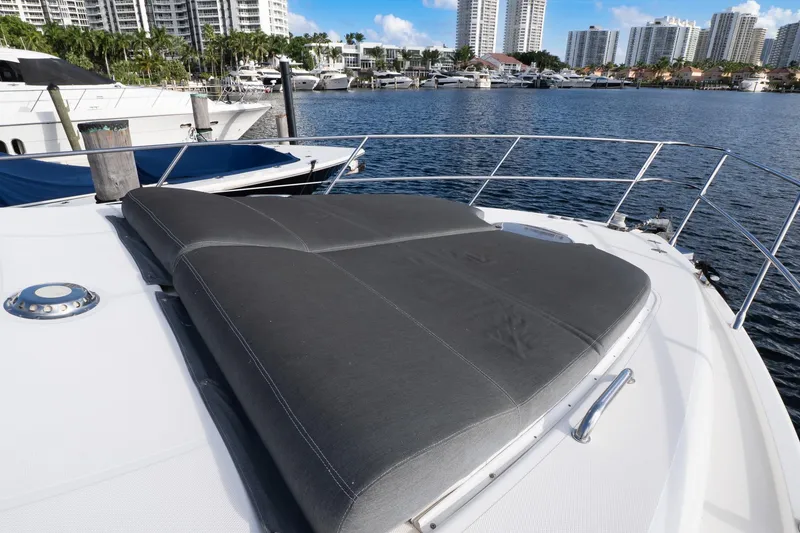 Slide: The Image of Luxurious 2008 Azimut Fly 50 yacht with spacious sunbathing area, docked in a scenic marina. - 22