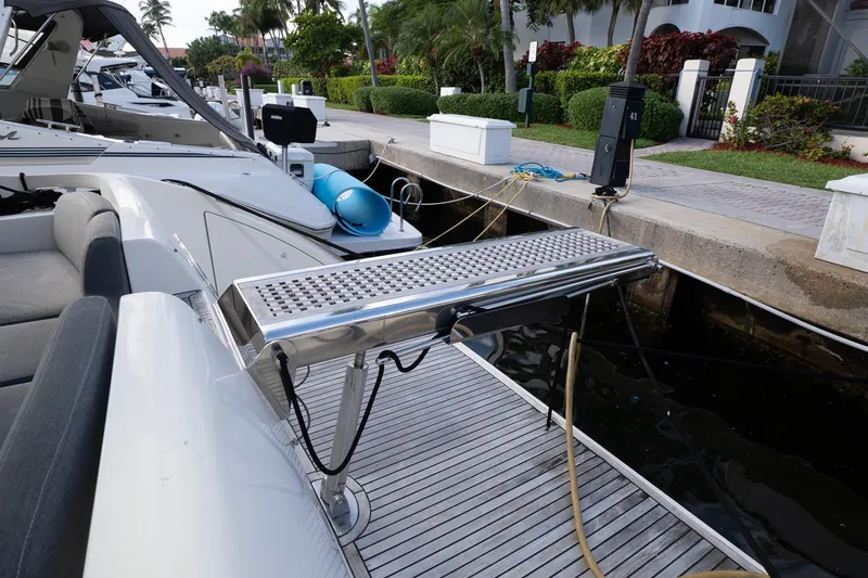 Slide: The Image of Docked 2008 Azimut Fly 50 yacht with gangway and lush surroundings. - 23