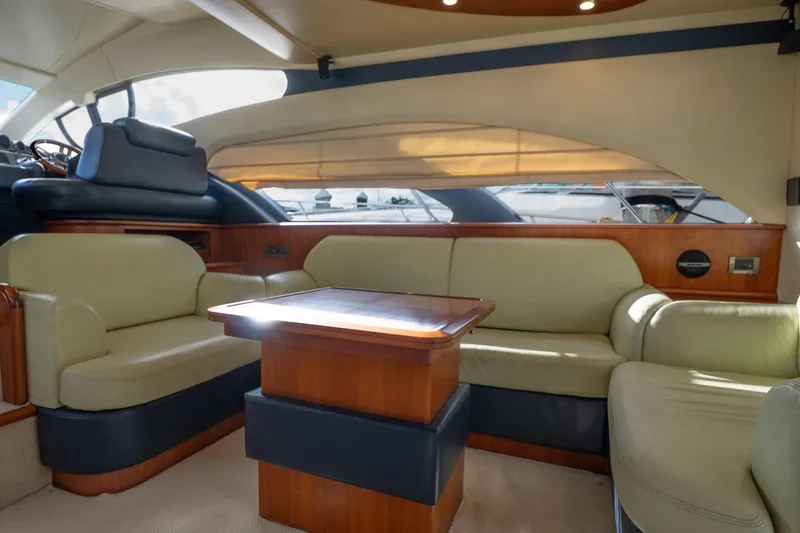 Slide: The Image of Luxurious interior of a 2008 Azimut Fly 50 yacht with elegant seating and wooden table. - 4