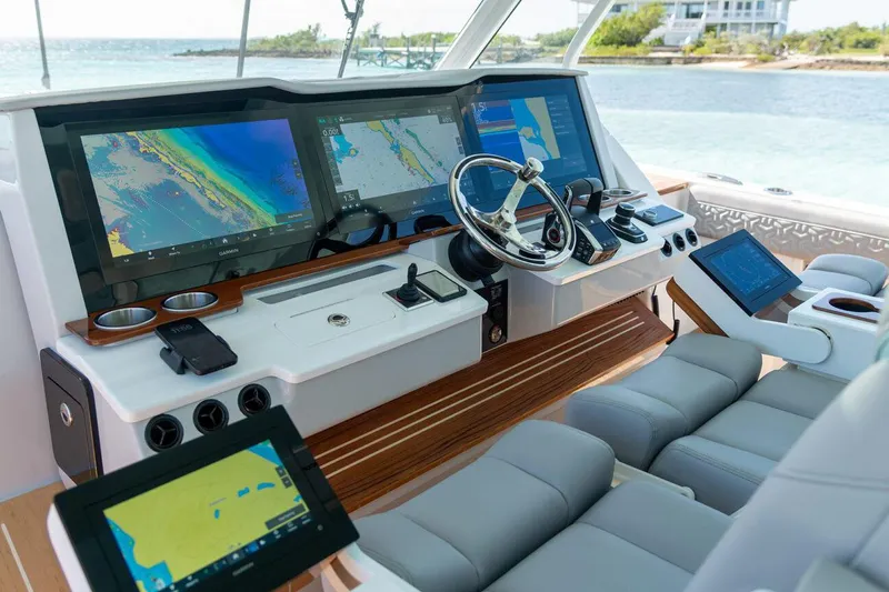 Slide: The Image of Manufacturer Provided Image: Helm of 2026 Regal 50 SAV yacht with advanced navigation displays and controls. - 9
