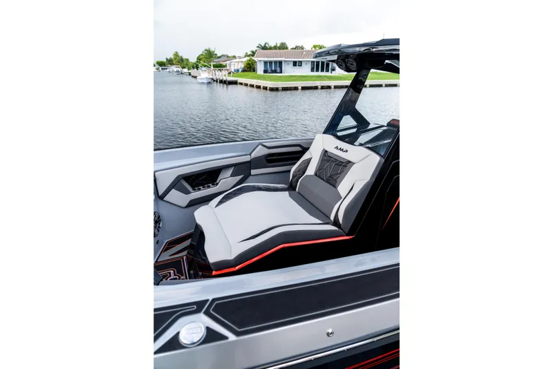 Slide: The Image of Luxury AMP 333 boat interior with sleek seating, modern design, and waterfront view, 2026 model. - 11