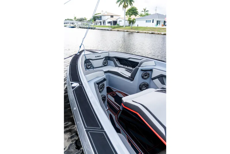 Slide: The Image of Modern AMP 333 boat interior, 2026 model, featuring sleek seating and advanced audio system. - 12
