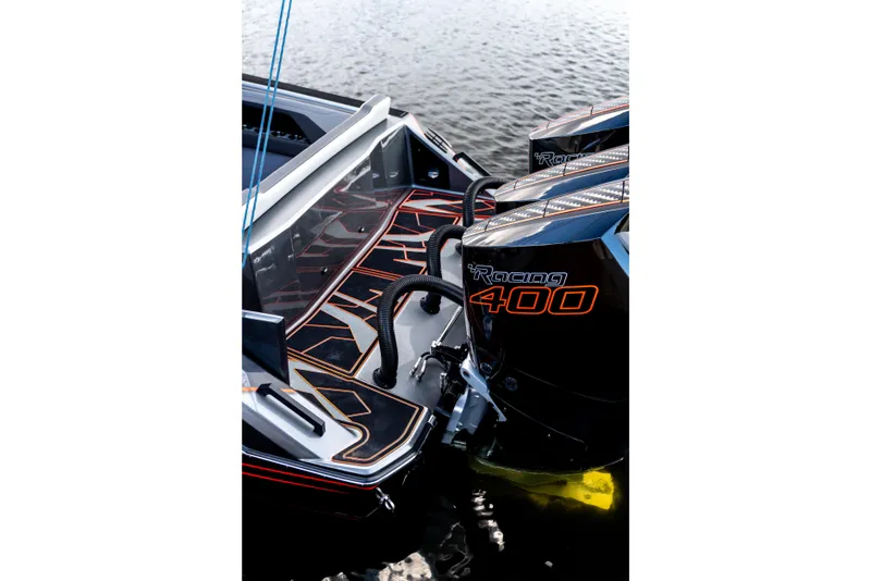 Slide: The Image of High-performance AMP 333 boat with Racing 400 engines, sleek design, 2026 model. - 13