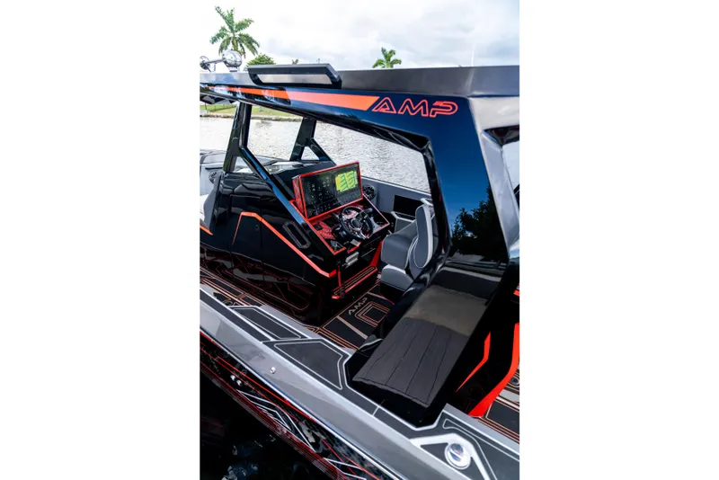 Slide: The Image of Futuristic AMP 333 boat interior with advanced dashboard, sleek design, and modern seating, 2026 model. - 5