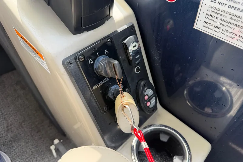 Slide: The Image of Control panel of a 2021 Barletta C20UC boat with Yamaha ignition and safety key. - 13