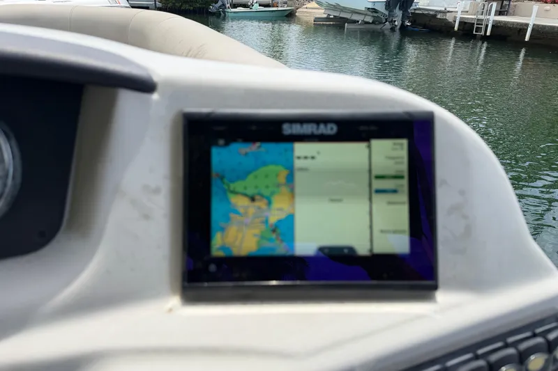 Slide: The Image of Dashboard of a 2021 Barletta C20UC boat with a Simrad navigation display. - 15