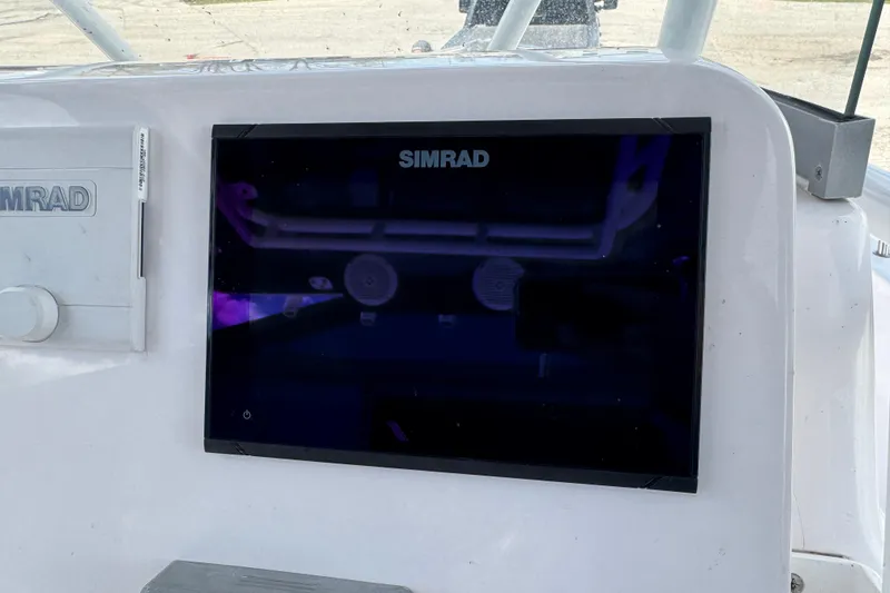 Slide: The Image of Simrad display on 2017 Pro-Line 26 Super Sport boat dashboard. - 10