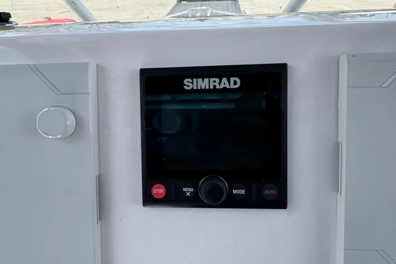 Slide: The Image of Simrad display on 2017 Pro-Line 26 Super Sport boat dashboard. - 11