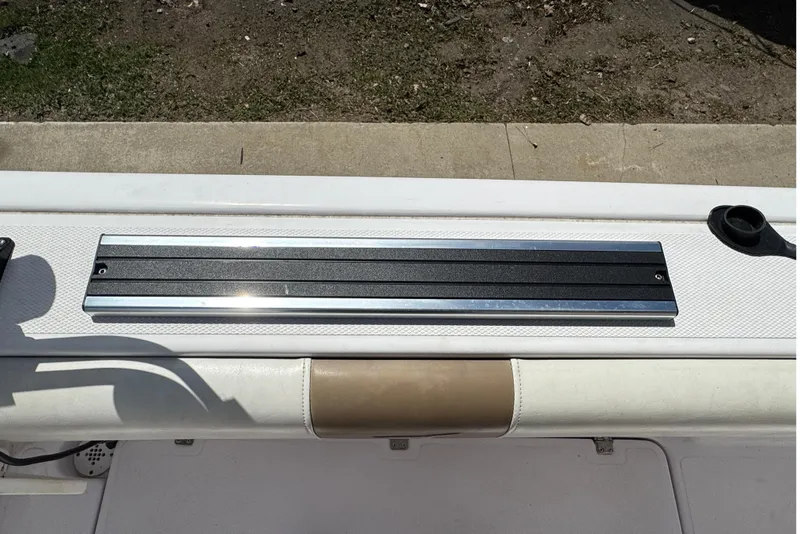 Slide: The Image of 2017 Pro-Line 26 Super Sport boat deck with mounted accessory rail. - 29